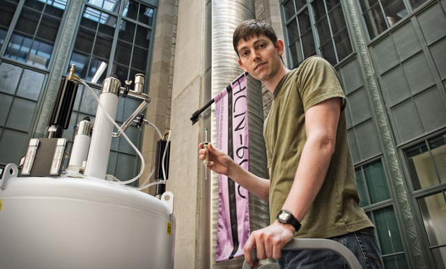 IBiS student Ryan Marcum uses an NMR instrument in Northwestern's IMSERC facility.